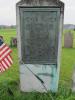 A cast bronze plate affixed to a marble stone 'in memoriam of the Meyer family buried in this plot'.