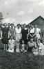 Group of women outside a barn Group of women outside a barn